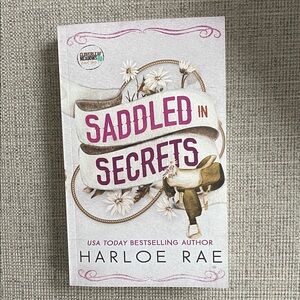 Saddled in Secrets • Harloe Rae Paperback Book